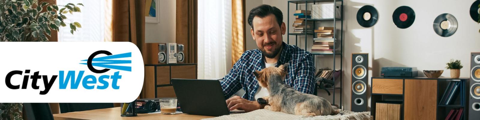 Guy at desk with laptop